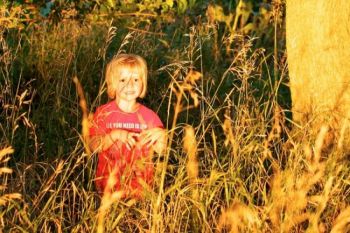 Exploring the tall grass in the perfect evening light makes a great end to a fun day at  Spirit Mound.