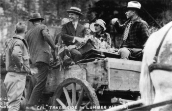 President Coolidge in a lumber wagon.